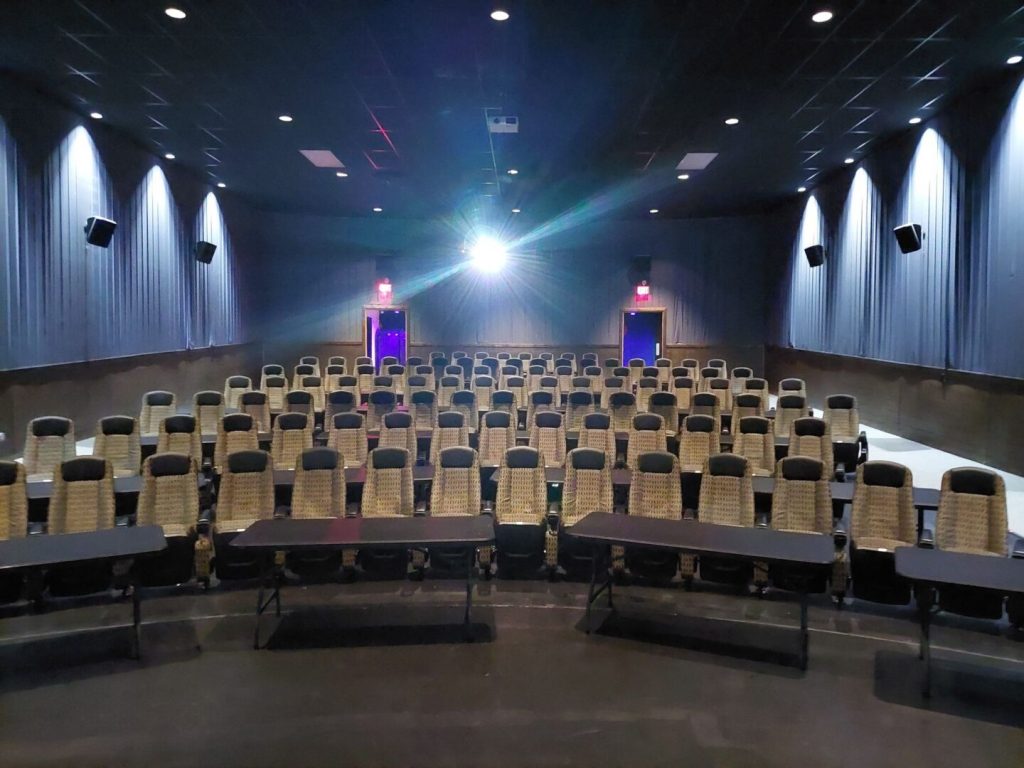 Mariner Theatre in Marinette Wisconsin. Locally Owned Movie Theater. View of the new luxury high back seats with tables in between each row, and 5 feet of space between the rows