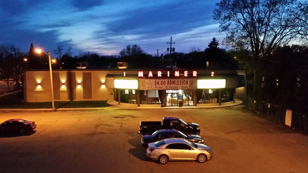 Mariner Theatre in Marinette Wisconsin. Locally Owned Movie Theater. View of the outside of the building and parking lot.